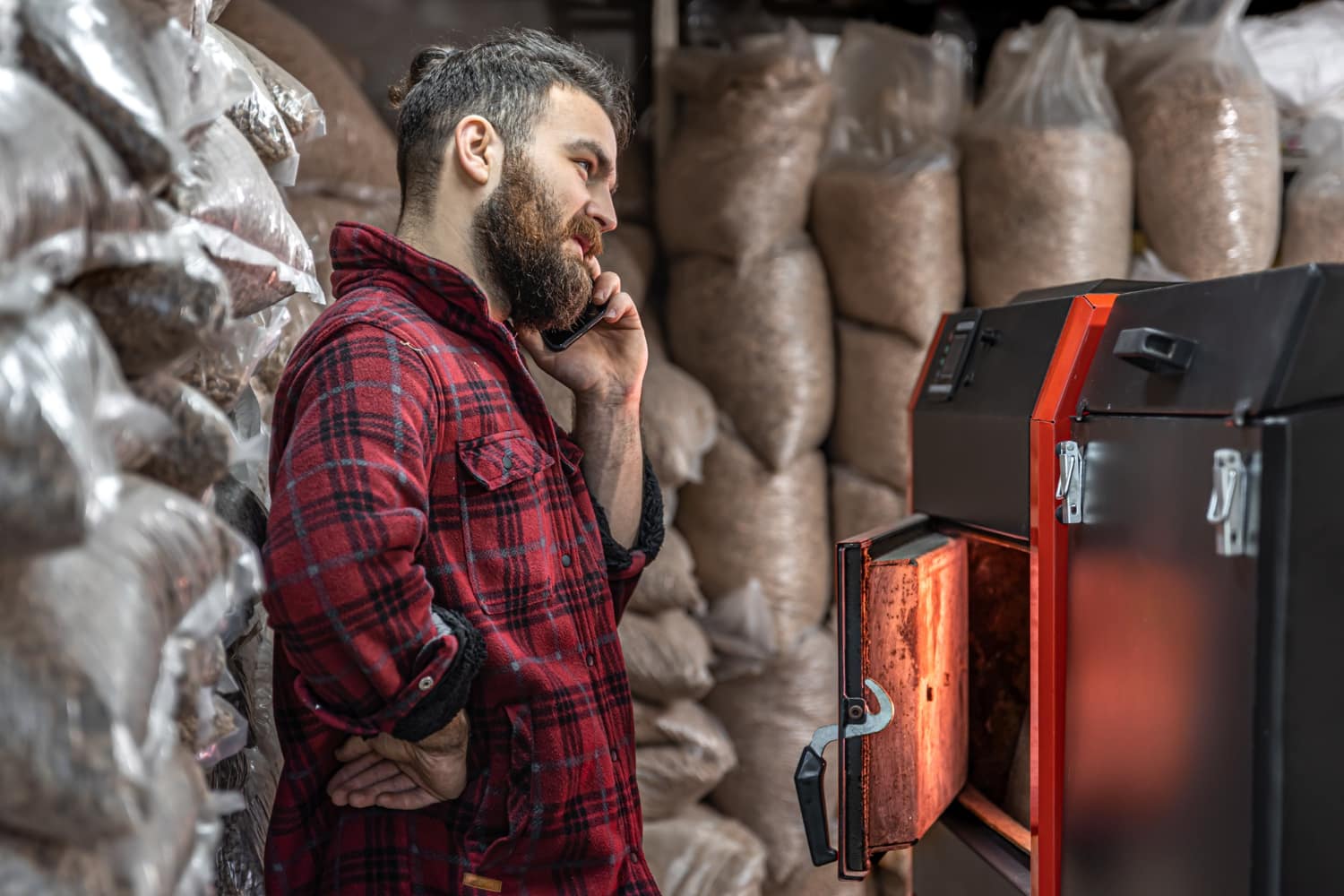 man-room-with-solid-fuel-boiler-working-biofuel-economical-heating